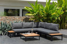 Outdoor grey L-shaped sofa set with teak accents and matching coffee table on patio