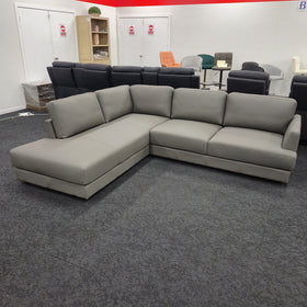 Portsea L-Shaped Corner Leather Sofa in light grey leather, angled view showing the full L-shape and loose back cushions, at The A2Z Furniture showroom