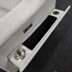 Sandgate Electric Corner Recliner Lounge in light grey fabric, console detail with a stainless steel cup holder, lined storage tray, electric recline control and reading light socket