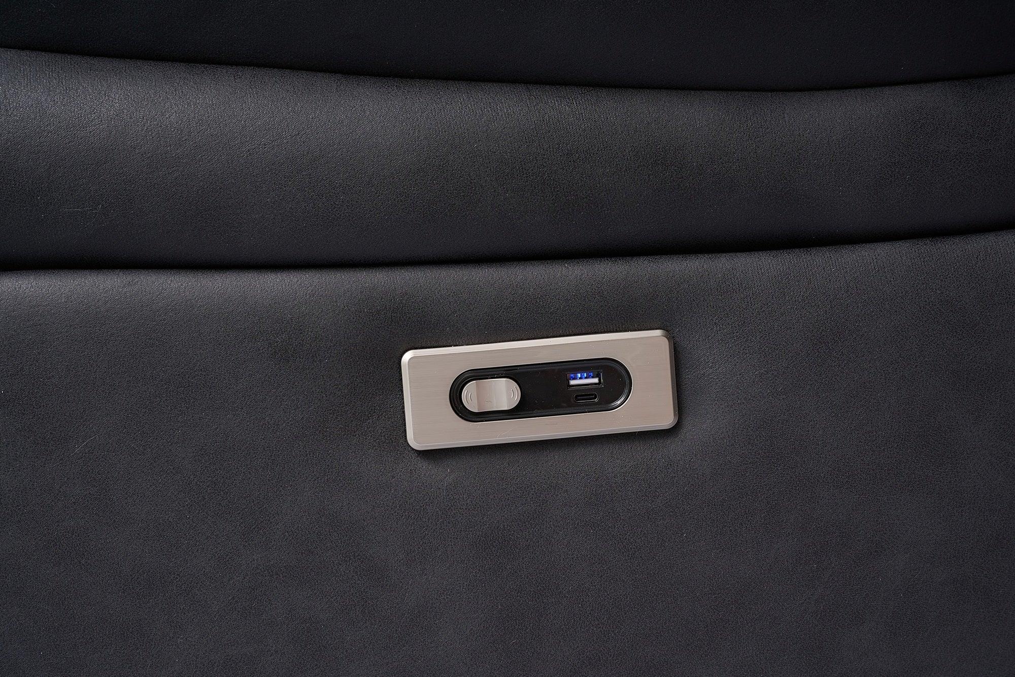 Close-up of modern sofa with built-in USB charging port and recliner control