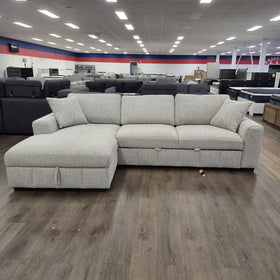Seaford Corner Sofa Bed in Light Grey on display in The A2Z Furniture showroom in sofa mode, chaise on the left when sitting.