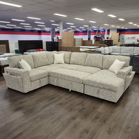 Sherwood U-Shaped Sofa Bed in Beige with the pull-out bed extended, showing the sleeping surface within the U-shaped layout.