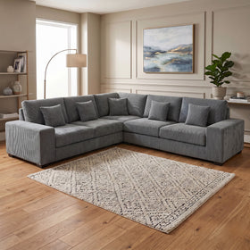 Skipper II Modular Corner Sofa in grey corduroy ribbed fabric, an L-shaped modular lounge with deep cushions and scatter pillows in a styled living room - The A2Z Furniture
