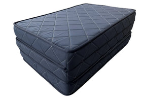 Stack of two blue mattresses on a white background