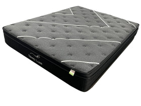 Gray mattress with white stitching on a white background