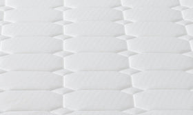 Top-down detail of the Sleep Rest Bonnell spring mattress showing its white quilted hexagonal-pattern sleeping surface