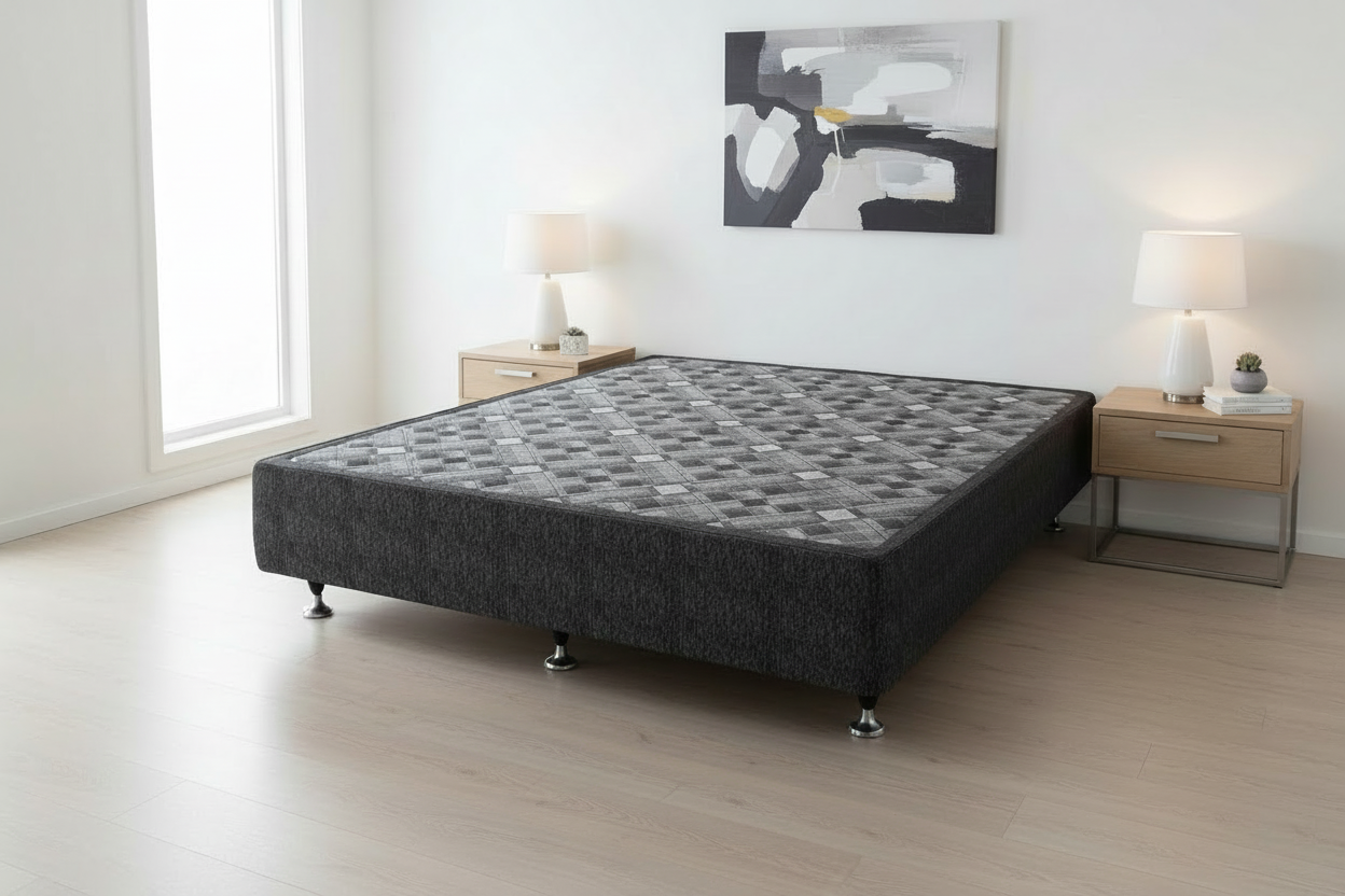 Bed base in a minimalistic bedroom with two nightstands and lamps.