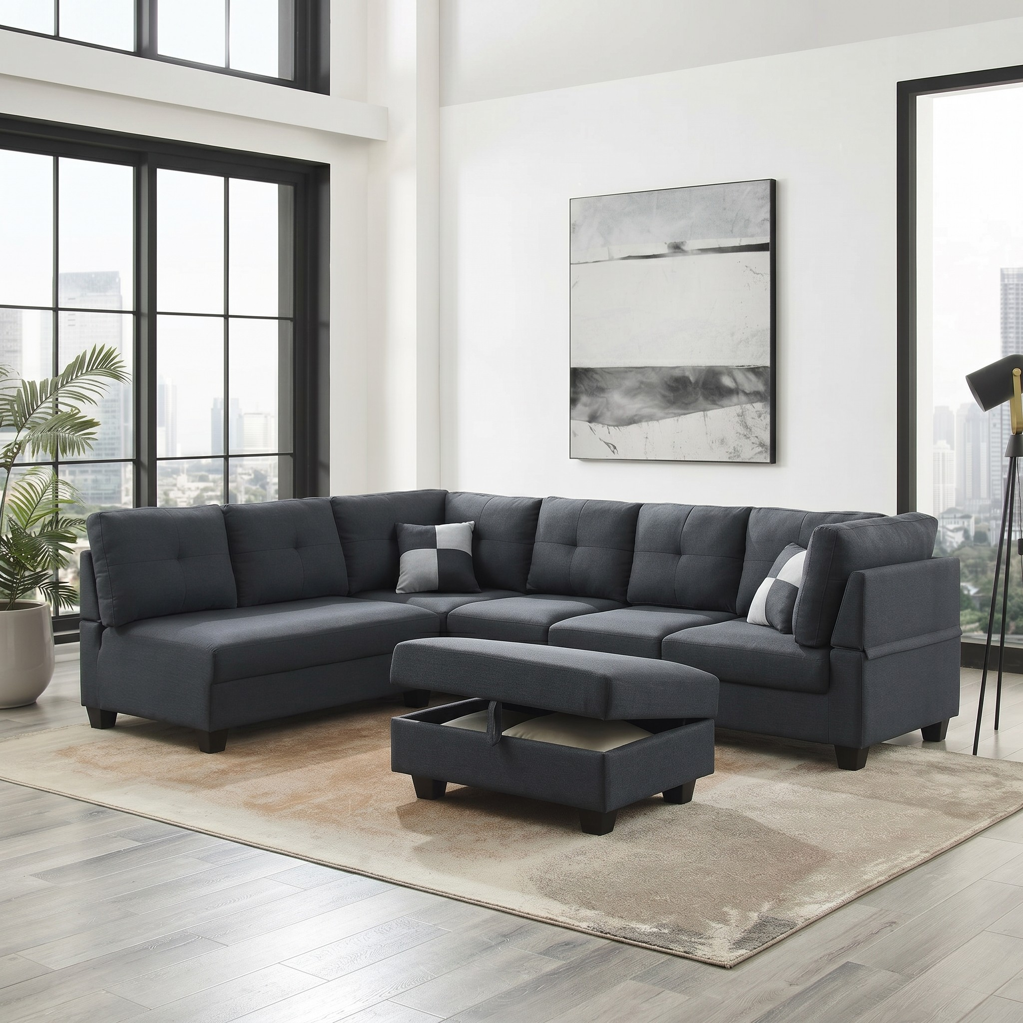 Gray sectional sofa in a modern living room with large windows and a cityscape view.