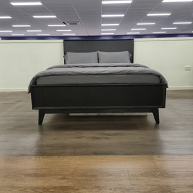 Tennyson Bed Frame in black wood finish on display in The A2Z Furniture showroom, shown with mattress and headboard.
