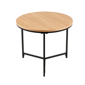 Ledora round table with oak-finish top and black metal tripod legs, angled view